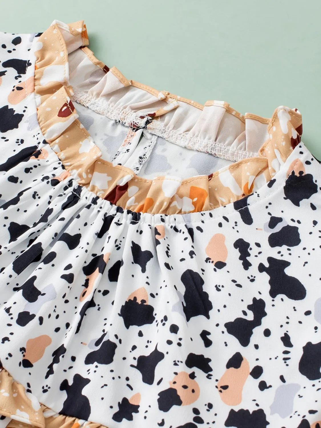 TEEK - White Ruffled Printed Mock Neck Cap Sleeve Blouse